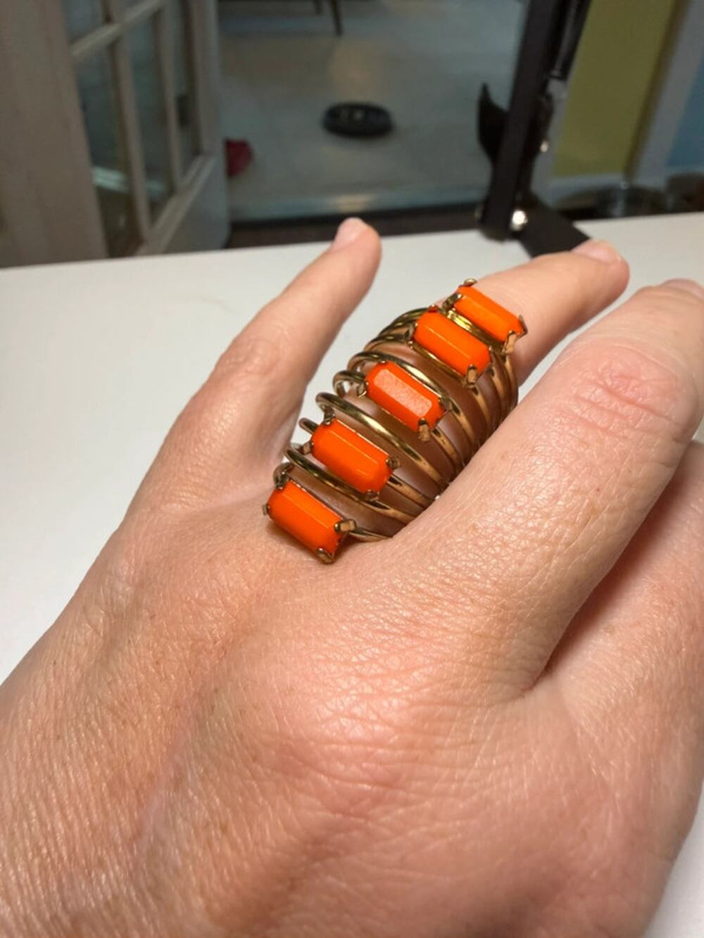 Gold tone and orange stone coiled ring size 8